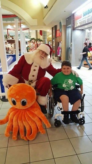 Santa Claus, aka CJ Skinner, stays jolly after losing a race at the Panama City Mall. CONTRIBUTED PHOTO