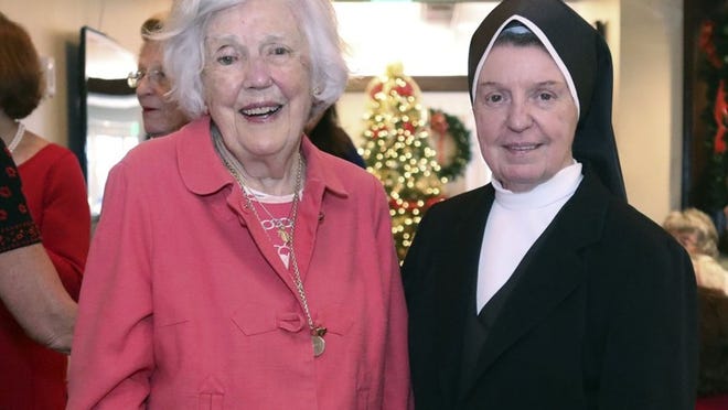 Marjorie Toner and Sister Jeanette D. Lindsay attend the Lourdes-Noreen McKeen third annual ‘Holiday Celebration Luncheon & Silent Auction’ Dec. 1 at the Sailfish Club. Damon Higgins / Daily News