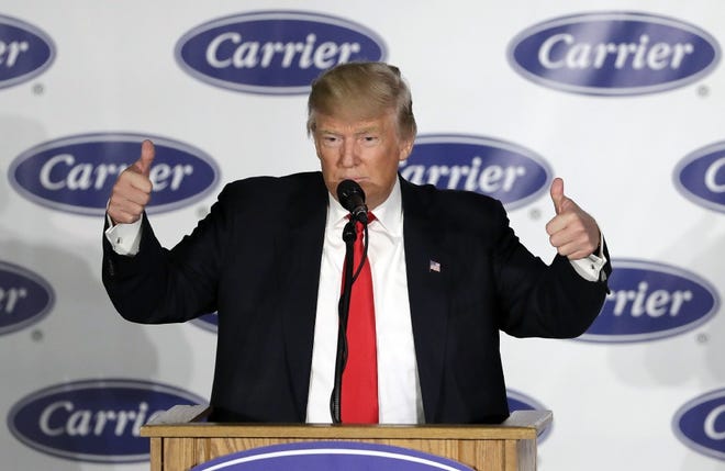 President-elect Donald Trump reacts after speaking at Carrier Corp Thursday, Dec. 1, 2016, in Indianapolis.
