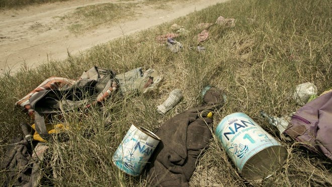 Empty cans of infant formula are left behind near the Rio Grande in Granjeno across from Reynosa, Tamaulipas, Mexico in 2014.