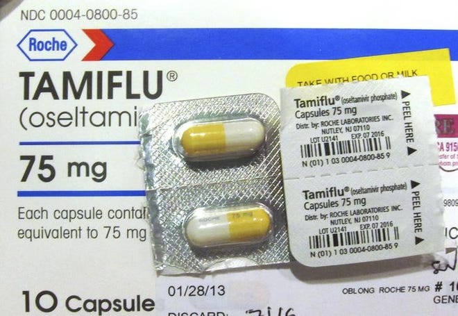 Four capules of Tamiflu are pictured on a Tamiflu box in Burbank, California,  January 31, 2013. (REUTERS/Fred Prouser)