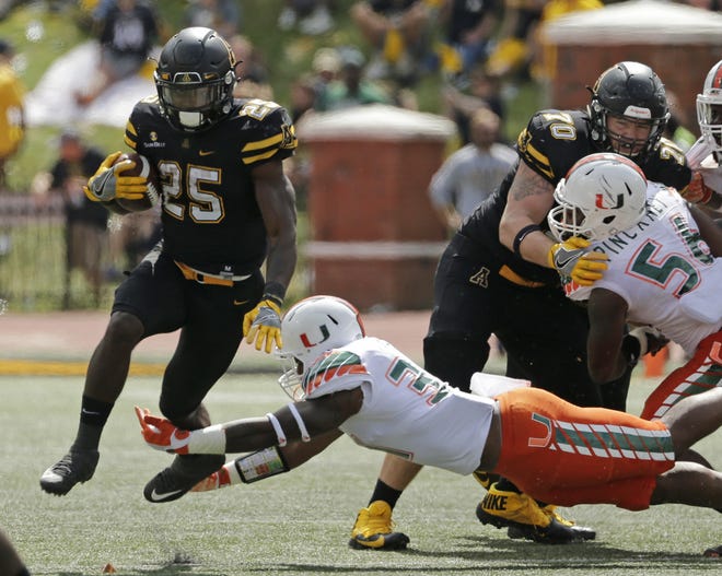 Appalachian State's Jalin Moore (25) runs past Miami's Demetrius Jackson (31) during the Sept. 17 game in Boone. 

The Crest High School graduate and Mountaineers' sophomore earned Sun Belt Offensive Player of the Year honors this season. 

AP Photo/Chuck Burton