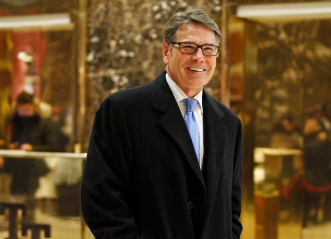 FILE - In this Dec. 12, 2016, file photo, former Texas Gov. Rick Perry smiles as he leaves Trump Tower in New York. President-elect Donald Trump selected Perry to be secretary of energy. (AP Photo/Kathy Willens, File)