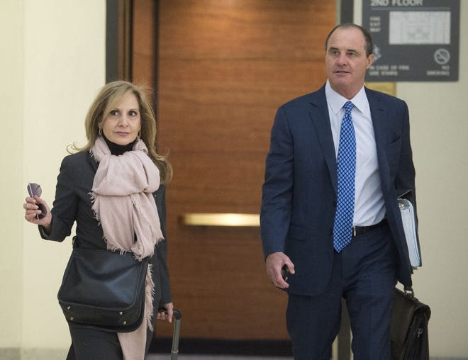 Bill Cosby's lawyer Brian McMonagle (right) with fellow counsel Angela Agrusa walks into Courtroom A in the Montgomery County Courthouse in Norristown for day two of the pretrial hearing in Cosby's sexual assault case  Wednesday, Dec. 14, 2016.