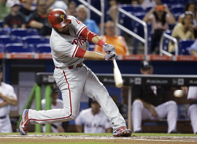 The Phillies' Andres Blanco hits a single during the first inning against the Marlins on Thursday in Miami.