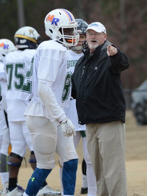 Steve Breitenstein gives directions to a North Carolina player duirng Shrine Bowl practice. Breitenstein will roam the sidelines on Saturday at Gibbs Stadium, where his son, Eric, starred for Wofford College. ALEX HICKS JR./Spartanburg Herald-Journal