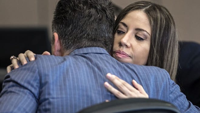 Dalia Dippolito hugs attorney Brian Claypool after her murder-for-hire retrial ended in a hung jury with a 3-3 tie Wednesday, December 14, 2016. (Lannis Waters / The Palm Beach Post)