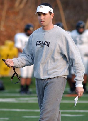 In this Dec. 9, 2006 file photo, Tommy Elrod walks on the field while he was serving as assistant coach at Wake Forest University. Elrod, who has served as a radio announcer for the Deacons football games since 2014, has been identified by Wake Forest as the source of leaked game plans found at the University of Louisville. (Kelly Bennett/Winston-Salem Journal via AP)
