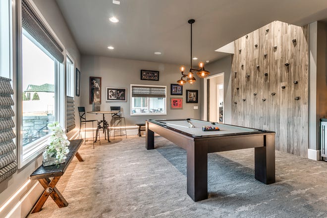This undated photo provided by the Central Oklahoma Home Builders Association and Authentic Custom Homes shows part of a recreation room in a luxury home in Oklahoma. (Authentic Custom Homes via AP)