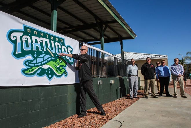 Josh Lawther, General Manager (right) unveils the new name for the former Daytona Cubs at the Jackie Robinson Ballpark. Daytona Beach on Thursday, Dec. 4, 2014.News-Journal/LOLA GOMEZ