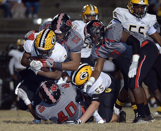 Boiling Springs' Rodney Hart (52) and a host of Bulldogs take down a Greenwood runner during last month's second-round playoff game. ALEX HICKS JR./Spartanburg Herald-Journal