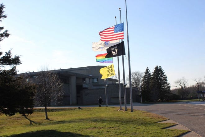 A "Black Lives Matter" flag blows in the wind on the UMass Dartmouth campus.