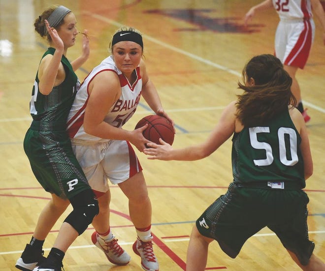 Ballard's Karlee Ahrenholtz drives by Pella's Caroline Bradley during the fourth quarter of the No. 11 Bombers' 49-23 loss to the No. 1 Lady Dutch Dec. 6 in Huxley.