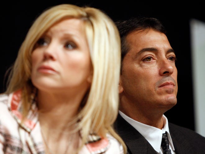 Actor Scott Baio, right, and his wife, Renee, are seen during a news conference to kick off National Newborn Screening Awareness Month in Los Angeles. Renee Baio alleged on Twitter Thursday, Dec. 15, 2016, that her husband was assaulted over his support of by Nancy Mack, the wife of Red Hot Chili Peppers drummer Chad Smith. (AP Photo/Matt Sayles, File)