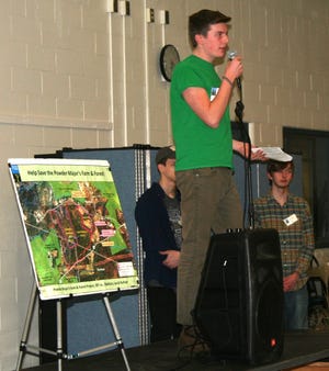 Nicholas Dundorf, ORHS Sustainability Club co-leader, welcomes guests to the ORHS cafeteria for the Feast for the Forest, a fundraiser for the Powder Major's Farm and Forest conservation project. Photo/Courtesy