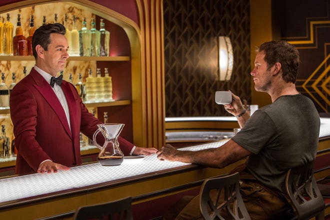 Arthur (Michael Sheen) serves his lone customer Jim (Chris Pratt) in “Passengers.” (Columbia Pictures)