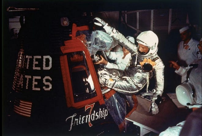 John Glenn climbs inside the Mercury capsule he dubbed, “Friendship 7” on Feb. 20, 1962, before launching into space. (NASA)