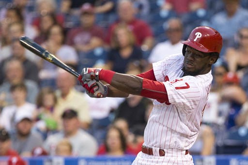 FILE - In a Monday, Aug. 29, 2016 file photo, Philadelphia Phillies' Odubel Herrera swings during the first inning of a baseball game against the Washington Nationals in Philadelphia. Outfielder Odubel Herrera and the Philadelphia Phillies have agreed to a $30.5 million, five-year contract, Thursday, Dec. 15, 2016. (AP Photo/Chris Szagola, File)