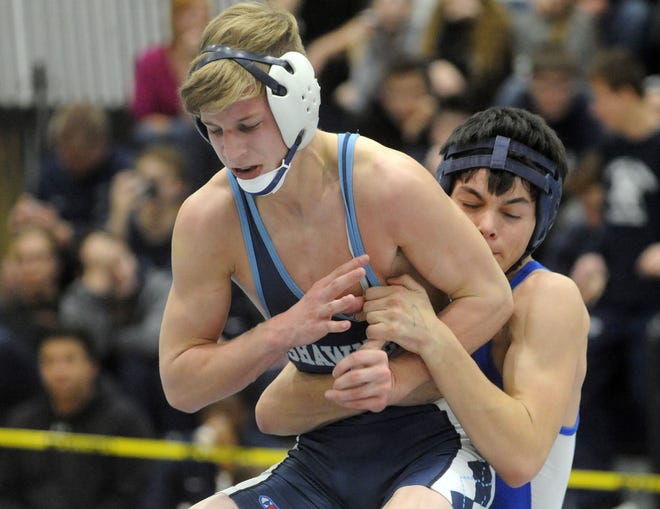 Shawnee's Matt Higgins (left) tangles with Shore Regional's Brad Smuro in the 120-pound championship match of the Pine Barrens Wrestling Tournament on Saturday, Dec. 17, 2016. Higgins won by fall.