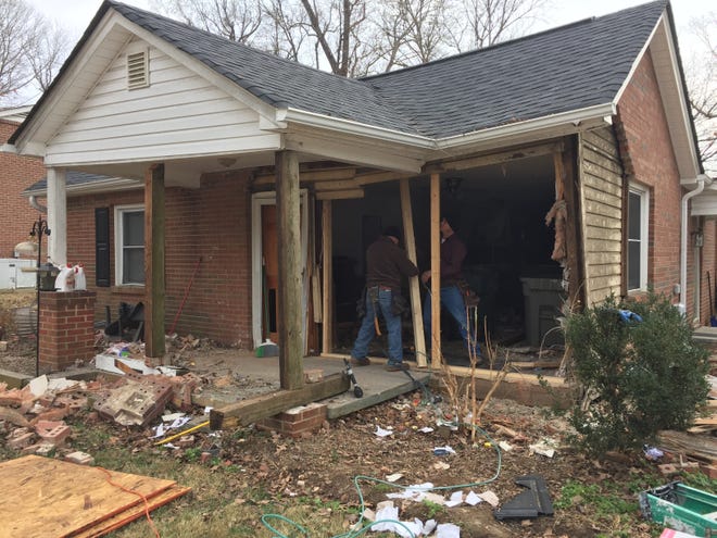 Workers spent Saturday securing a home after a truck crashed into it Friday night.

DIANE TURBYFILL
