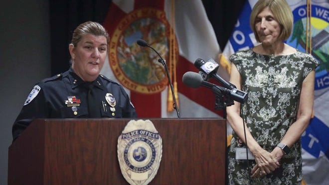 Sarah Mooney (left) speaks to members of the media after Mayor Muoio (right) announced her appointment as Chief of Police for the City of West Palm Beach Tuesday, December 13, 2016 in the Police Department Community Room. (Bruce R. Bennett / The Palm Beach Post)
