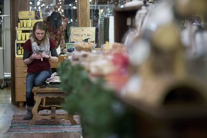 Jene Seal looks at bracelets at Minglewood on Dec. 8, 2016, during Shop on State in downtown Rockford. RRSTAR.COM FILE PHOTO