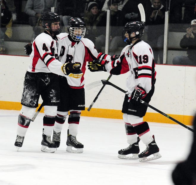 ORR/Fairhaven's Noah Strawn left, and Zak Labonte right reach out to celebrate a goal over Marblehead at Tabor Academy in Marion. DAVID W. OLIVEIRA/STANDARD-TIMES SPECIAL/SCMG