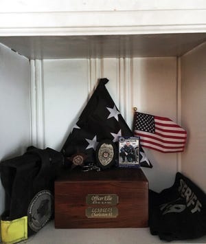 Booneville police officer Norman Wilder has this memorial in his home for his late partner, K-9 officer Ellie. Ellie was diagnosed with cancer and put to sleep. Submitted photo