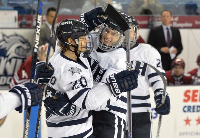 Freshmen, like linemates Brendan van Riemsdyk, center, and Patrick Grasso, left, have been thrown right into the fire this season for the New Hampshire men's hockey team. 
Photo by Drew Hallett/Fosters.com