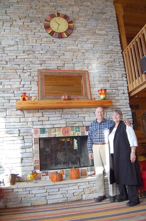 The fireplace in the cedar home owned by Gary Barber and Penny Greiling reaches the ceiling. NANCY HASTINGS PHOTO