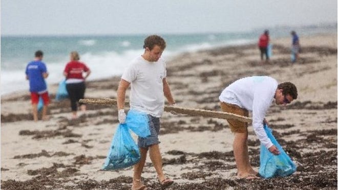 Volunteers at recent beach cleanup (File Photo)