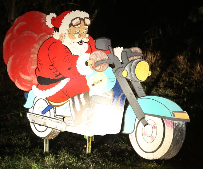 Santa on a motorcycle can be seen in the Christmas display on state Route 416 in Goshen. (TimesReporter.com / Jim Cummings)