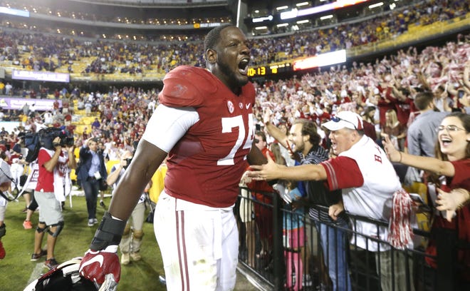 Alabama offensive lineman Cam Robinson (74) celebrates with fans after Alabama's 10-0 win over LSU in Tiger Stadium Nov. 5. Staff Photo/Gary Cosby Jr.