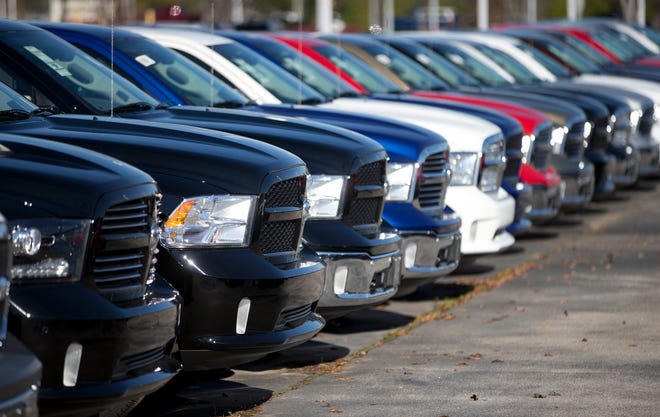 In this Jan. 5, 2015 file photo, Ram pickup trucks are on display on the lot at Landmark Dodge Chrysler Jeep RAM in Morrow, Ga. The U.S. auto safety agency has opened an investigation into complaints that another 1 million Fiat Chrysler vehicles can roll away after the owners shift transmissions into park, a problem similar to the one being blamed in the death of Star Trek actor Anton Yelchin. The investigation by the National Highway Traffic Safety Administration covers Fiat Chrysler’s top-selling vehicle, the Ram 1500 pickup from the 2013 to 2016 model years, as well as the 2014 to 2016 Dodge Durango. (AP Photo/John Bazemore, File)