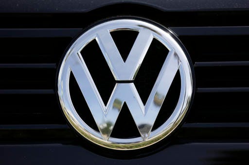 FILE - In this Sept. 21, 2015, file photo, a Volkswagen logo is seen on car offered for sale at New Century Volkswagen dealership in Glendale, Calif. Volkswagen is facing a deadline of Monday, Dec. 19, 2016, to tell a federal judge in San Francisco whether it has reached a deal with U.S. regulators and attorneys for car owners on the remaining 80,000 diesel vehicles that cheated on emissions tests. (AP Photo/Damian Dovarganes, File)