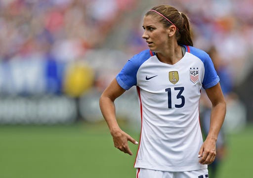 FILE - In this Sunday, June 5, 2016 file photo, United States forward Alex Morgan stands during the first half of an international friendly soccer match against Japan in Cleveland, Ohio. United States forward Alex Morgan has joined Lyon from Orlando Pride on a six-month deal with an option for a further season. The highly successful French club announced the loan move in a statement on Tuesday, Dec. 20, 2016. (AP Photo/David Dermer, file)