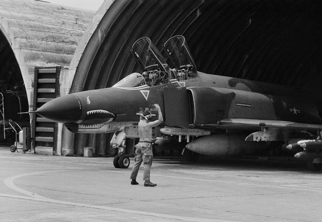 In this April 23, 1966 file photo a U.S. Air Force F-4 Phantom jet is guided out of its revetment in Da Nang formerly South Vietnam, at the start of a bombing mission over the DMZ area and North Vietnam. The last of thousands of F-4 Phantom jets that have been a workhorse for the U.S. military over five decades are being put to pasture to serve as ground targets for strikes by newer aircraft. FILE PHOTO/ASSOCIATED PRESS