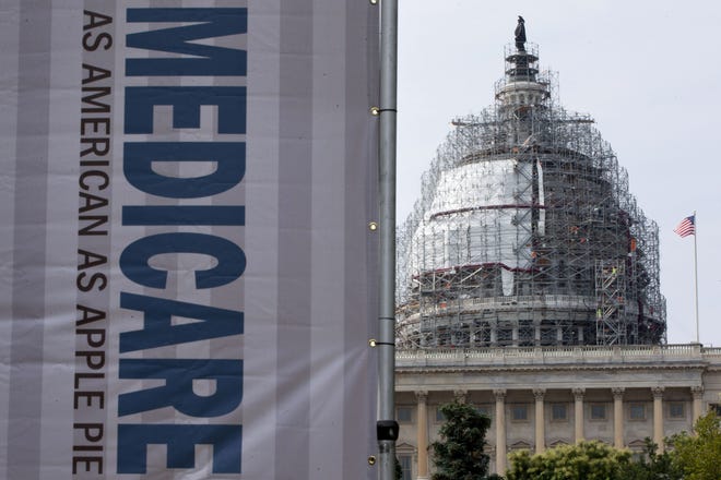 In this July 30, 2015 photo, a sign supporting Medicare is seen on Capitol Hill in Washington. (AP photo/Jacquelyn Martin)