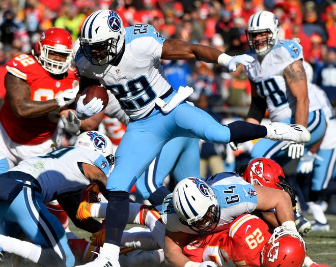 Tennessee Titans running back DeMarco Murray vaults Kansas City Chiefs defensive back Eric Berry during a Dec. 18 game in Kansas City. [AP Photo]