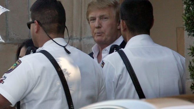 President-elect Donald J. Trump leaves the Episcopal Church of Bethesda by-the-Sea prior to his 2005 wedding to Melania Knauss. There is no official word from his transition team whether he would attend Christmas services at the Palm Beach house of worship. (Greg Lovett / Staff photographer)
