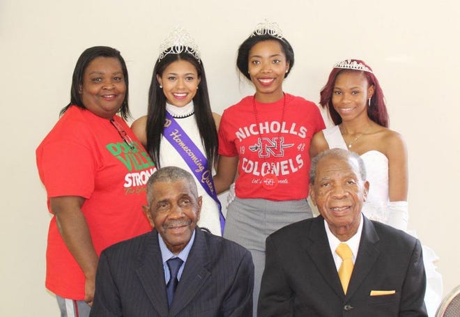 2016 parade royalty. Back row from left: Angelia Elzy, Paige Joseph, ACHS Homecoming Queen, Delicia Landry, Nicholls State Homecoming Queen and Kamri Gray, White Castle Homecoming Queen. Front: Mr. Henry “Bucket” Scott (left), Iberville Parish retiree and SJBC Deacon and Rev. Johnny Williams, 2016 Parade Grand Marshal, Pastor of Progressive Baptist Church.