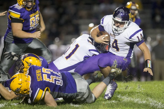 Belvidere quarterback Austin Revolinski is tripped up against Hononegah in September. Chuck Leonard, who has resigned after four years, built an offense at Belvidere around a dual-threat quarterback. Revolinski and Leonard's QB before him, Colton Bahling, are the only two players in NIC-10 history with over 3,000 combined yards in a season. FILE PHOTO/RRSTAR.COM