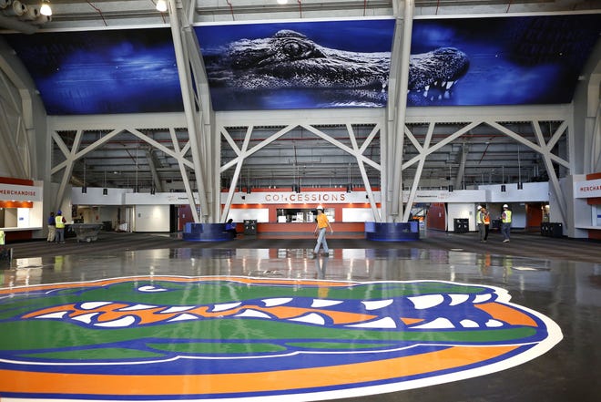 In this Dec. 15, 2016 file photo, workers put the finishing touches on the newly renovated Exactech Arena at the Stephen C. O'Connell Center in Gainesville. THE GAINESVILLE SUN FILE PHOTO / BRAD MCCLENNY