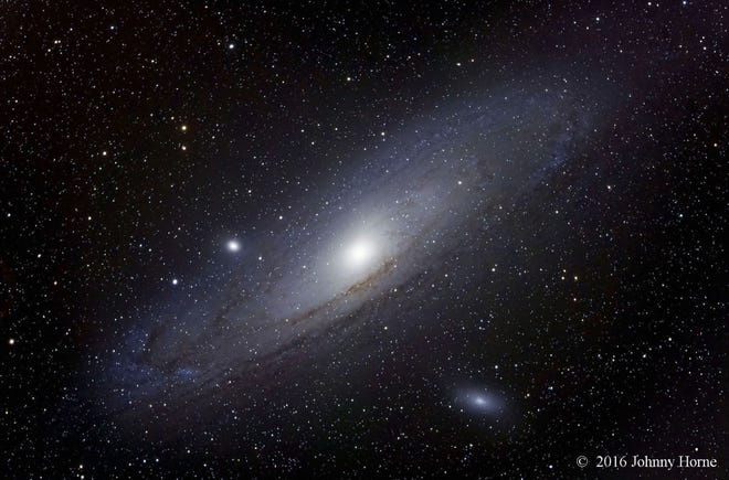 Two satellite galaxies accompany the large Andromeda Galaxy in this photo made with a 4" refractor telescope in November 2016. The picture was made by combining 17 five-minute exposures of the galaxy shot with a Nikon D750 digital camera. Though the Andromeda Galaxy appears as a mere fuzzy oval to the unaided eye, long exposure photos like this one show many dramatic features in the distant galaxy.
