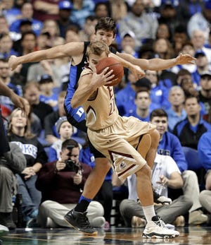 Elon's Steven Santa Ana is tripped by Duke's Grayson Allen in the first half of Wednesday night's victory.