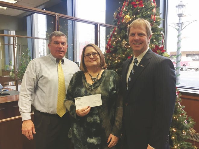 From the left are Boone U.S. Bank branch manager Dan Dighton, Sheila Gibbons of Crawford Hall Family Shelter and U.S. Bank market president Scot Kinne. Kinne presented Crawford Hall with a check for $500.