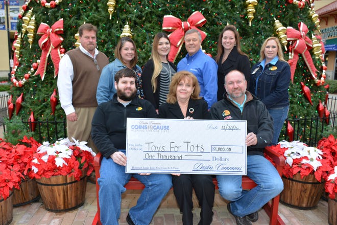 Destin Commons recently presented a donation to Toys For Toys. KAY PHELAN/SPECIAL TO THE LOG