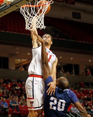 Texas Tech’s Zach Smith (11) dunks the ball over Longwood’s Obi Romeo (20) during the Red Raiders’ game against Longwood, Wednesday, Dec. 21, 2016, at United Supermarkets Arena in Lubbock, Texas. (Brad Tollefson/A-J Media)