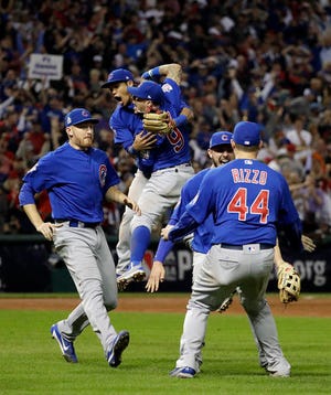 FILE - In this Nov. 3, 2016 file photo, the Chicago Cubs celebrate after Game 7 of the Major League Baseball World Series against the Cleveland Indians in Cleveland. The Cubs won 8-7 in 10 innings to win the series 4-3. (AP Photo/David J. Phillip, File)