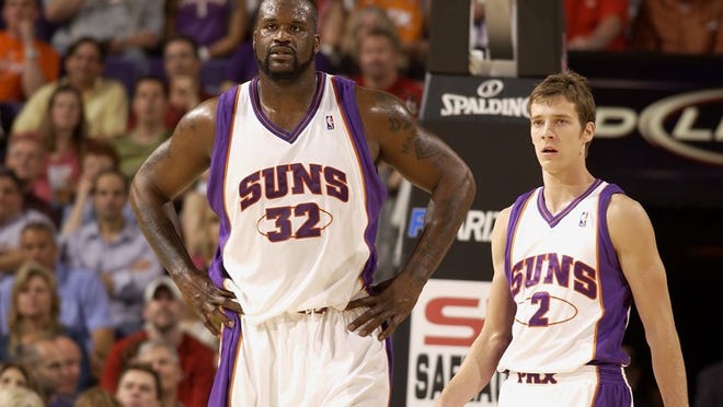 PHOENIX - MARCH 18: (L-R) Shaquille O'Neal #32 and Goran Dragic #2 of the Phoenix Suns take a break from the action during the game against the Philadelphia 76ers on March 18, 2009 at US Airways Center in Phoenix, Arizona. The Suns won 126-116. NOTE TO USER: User expressly acknowledges and agrees that, by downloading and/or using this Photograph, user is consenting to the terms and conditions of the Getty Images License Agreement. Mandatory Copyright Notice: Copyright 2009 NBAE (Photo by Barry Gossage/NBAE via Getty Images)